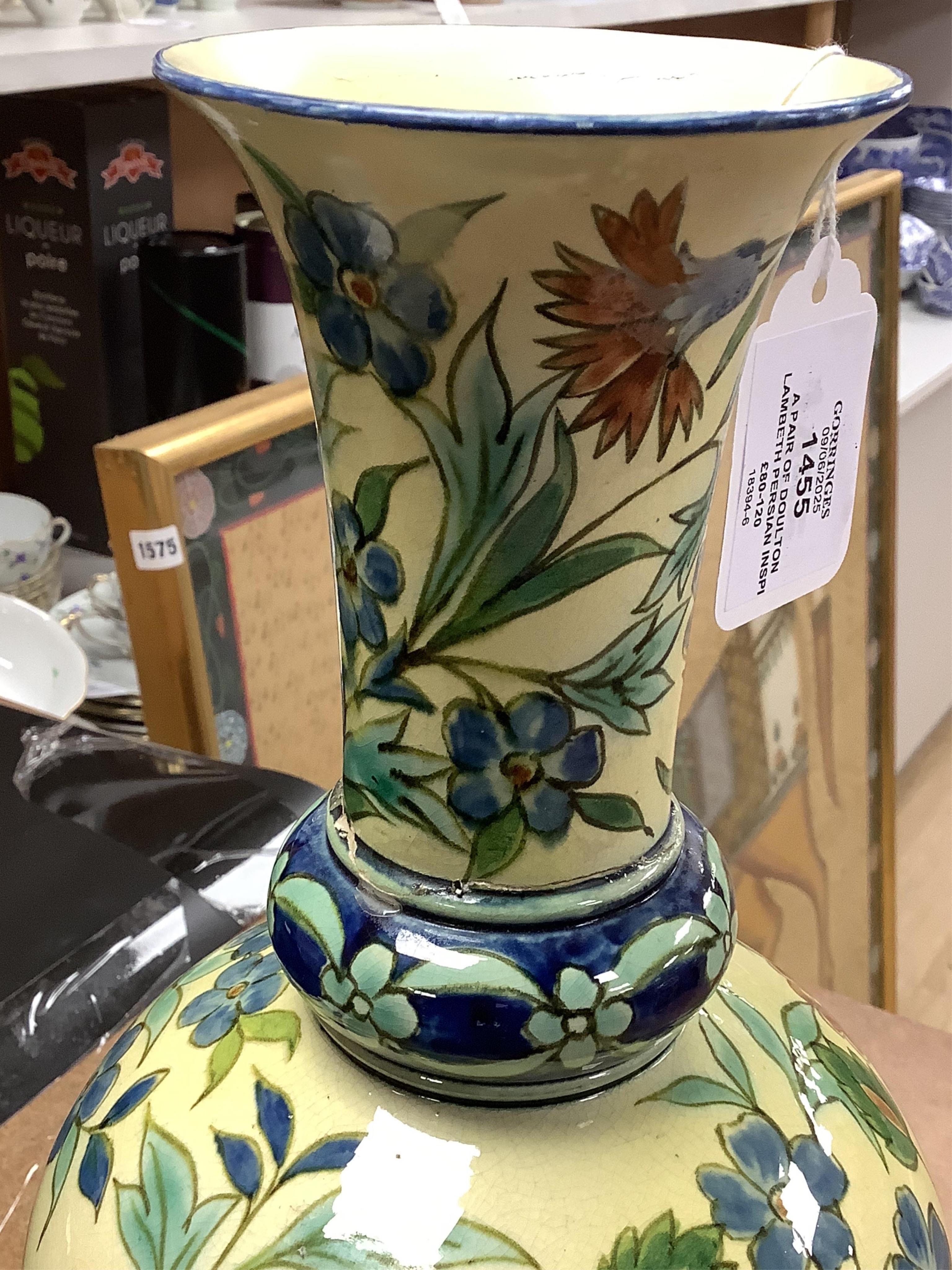 A pair of Doulton Lambeth Persian inspired faience vases, dated 1877, restored, 37cm high